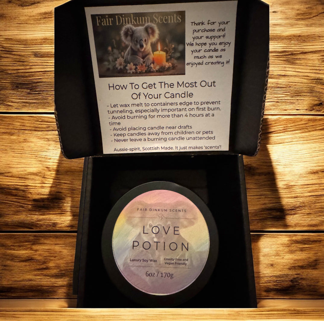 Inside view of box showing stylish black tin, lid, and label align with candle care card. 