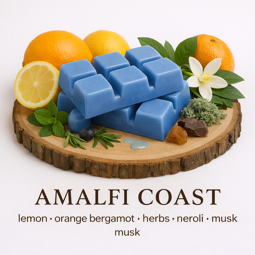 Blue wax melts on a wooden board with citrus fruits, herbs, and flowers, labeled 'Amalfi Coast'. By Fair Dinkum Scents