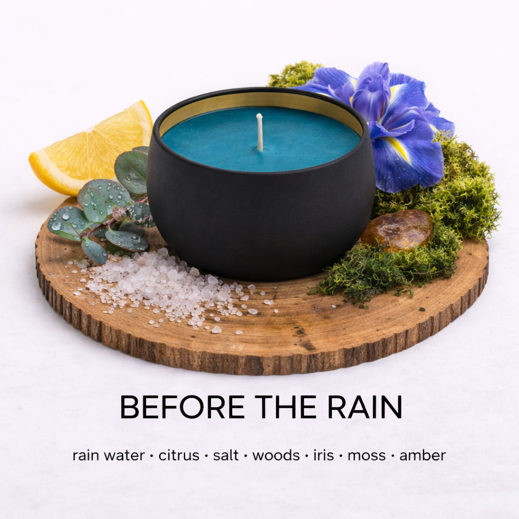 Candle labelled 'Before the Rain' with ingredients on a wooden board. By Fair Dinkum Scents