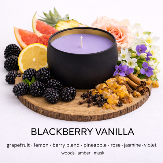 Blackberry Vanilla candle with fruits and flowers on a white background by a Fair Dinkum Scents