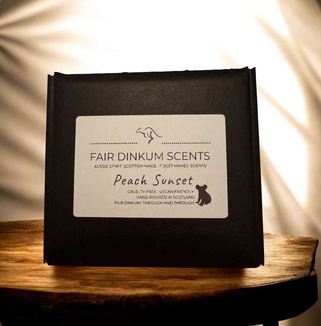 Peach Sunset soy candle with peach almond cashmere and warm musky fragrance in its box by Fair Dinkum Scents